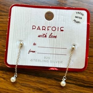 Sterling silver and fresh water pearl dangling earrings.